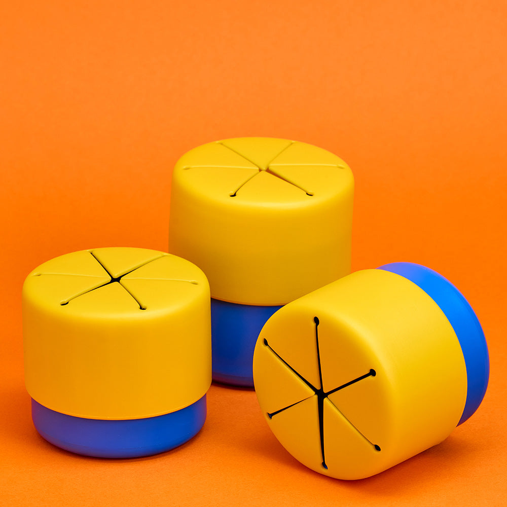 A snack cup with blue underneath and yellow on the lid